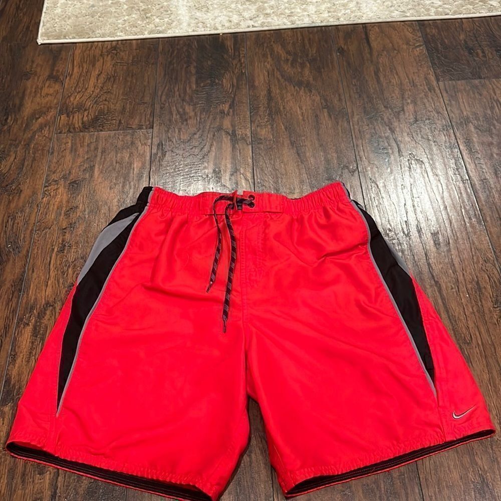 nike swim trunks size L red and black embroidered grey logo EUC with pockets‎